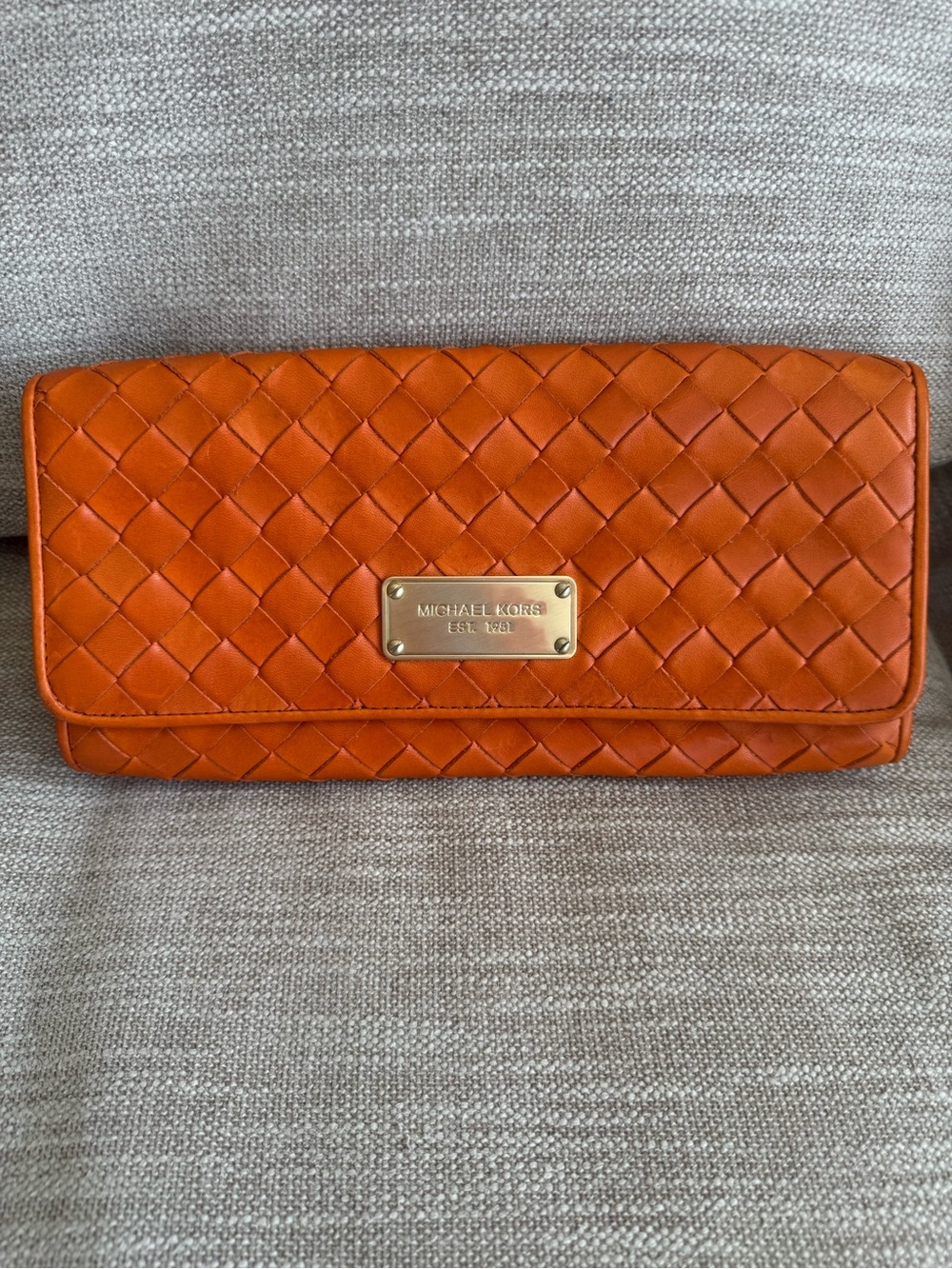 Michael Kors leather clutch in burnt orange